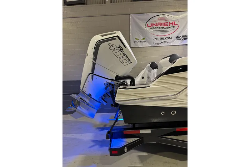 Slide: The Image of 2026 Sunsation 32 CCX boat with powerful outboard engine in a showroom. - 6