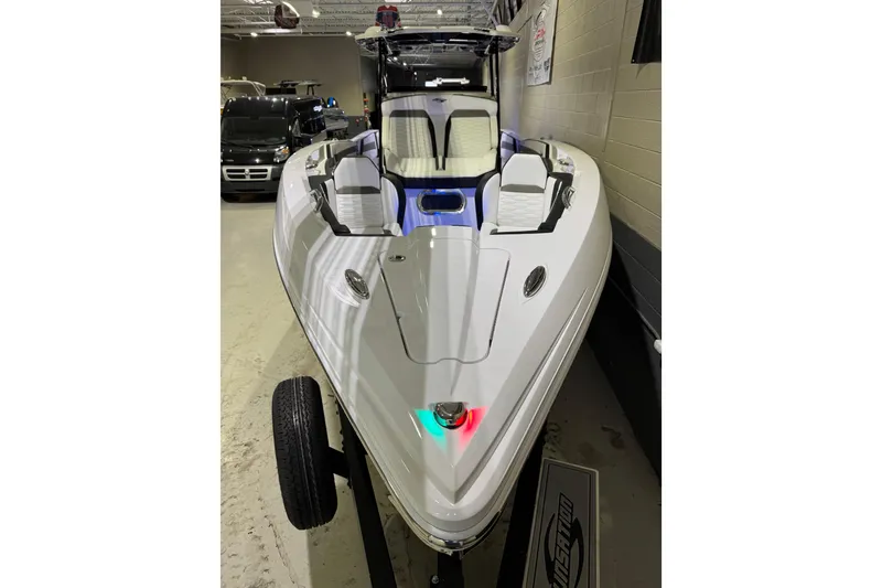 Slide: The Image of 2026 Sunsation 32 CCX boat in showroom, sleek design with modern features. - 9