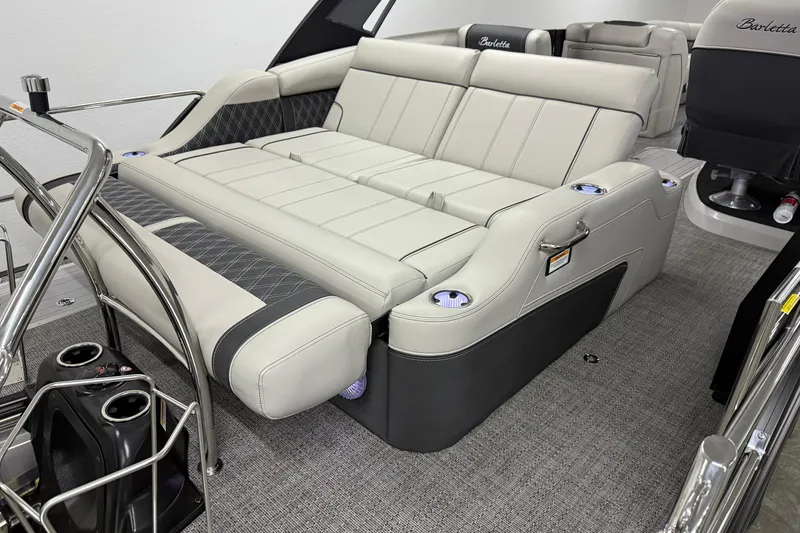 Slide: The Image of 2026 Barletta Lusso 25UA luxury boat interior with plush seating and cup holders. - 12