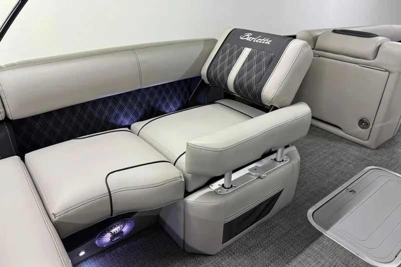 Slide: The Image of Luxurious seating in 2026 Barletta Lusso 25UA pontoon boat, featuring elegant upholstery and ambient lighting. - 22