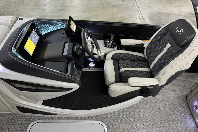 Slide: The Image of 2026 Barletta Lusso 25UA boat cockpit with luxurious seating and advanced control panel. - 24