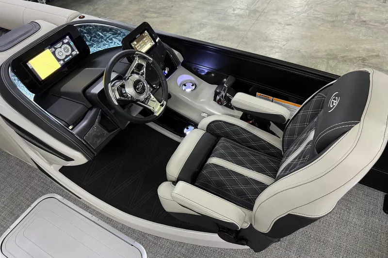 Slide: The Image of 2026 Barletta Lusso 25UA boat interior with modern dashboard and luxurious seating. - 25