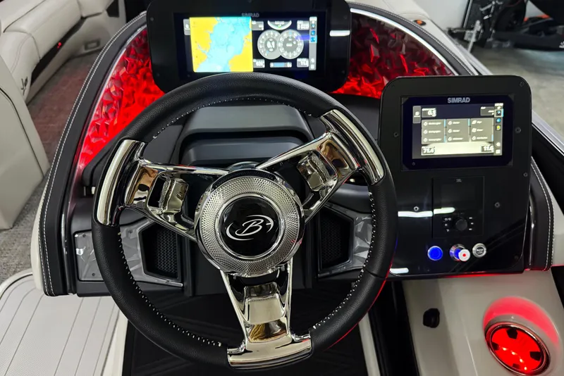 Slide: The Image of 2026 Barletta Lusso 25UA boat dashboard with modern steering wheel and digital displays. - 28