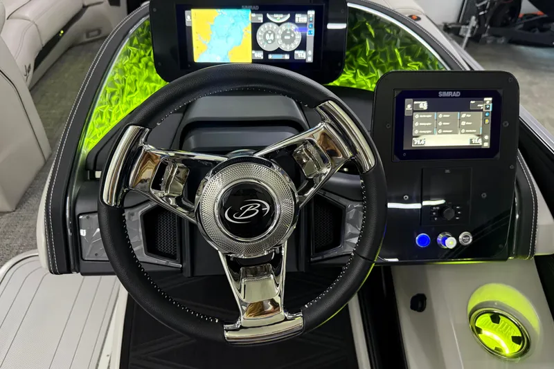 Slide: The Image of 2026 Barletta Lusso 25UA boat dashboard with modern steering wheel and digital displays. - 30