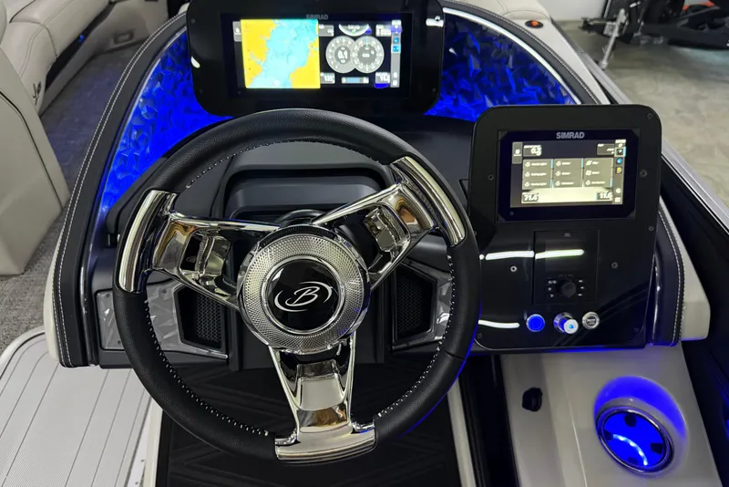 Slide: The Image of 2026 Barletta Lusso 25UA boat dashboard with modern steering wheel and digital displays. - 31