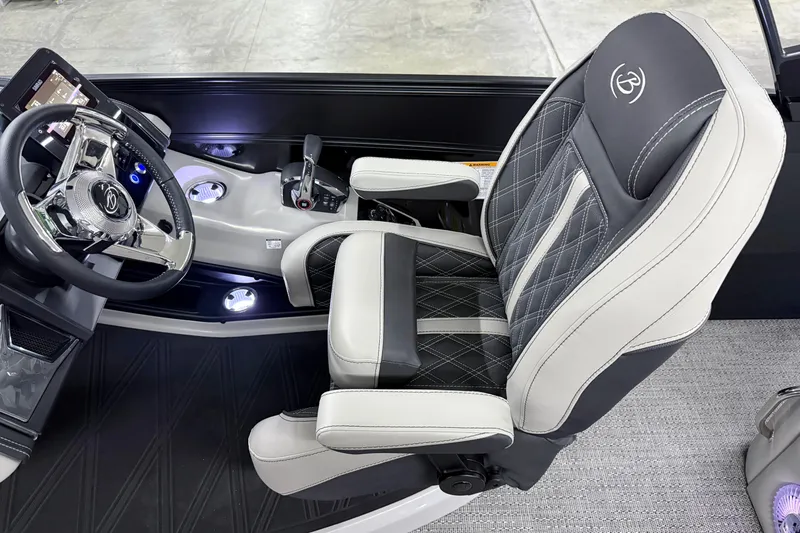 Slide: The Image of 2026 Barletta Lusso 25UA helm with luxury captain's chair and modern steering console. - 35
