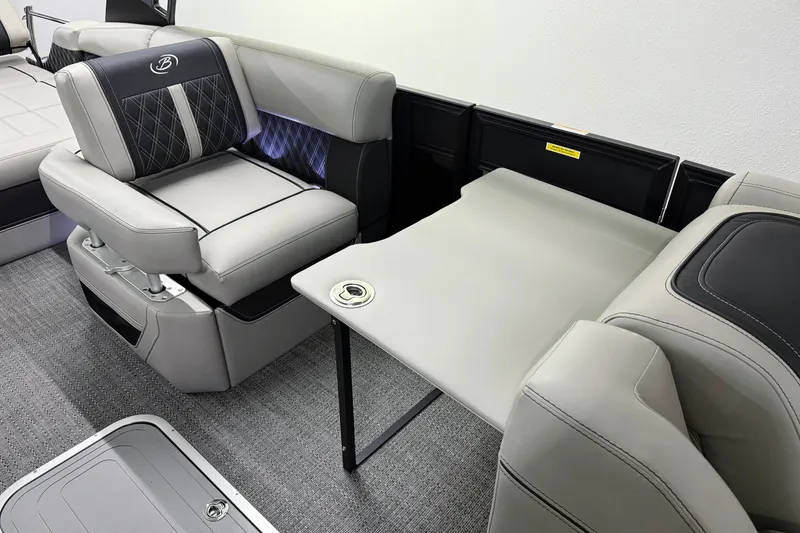 Slide: The Image of 2026 Barletta Lusso 25UA boat interior with luxurious seating and foldable table. - 37