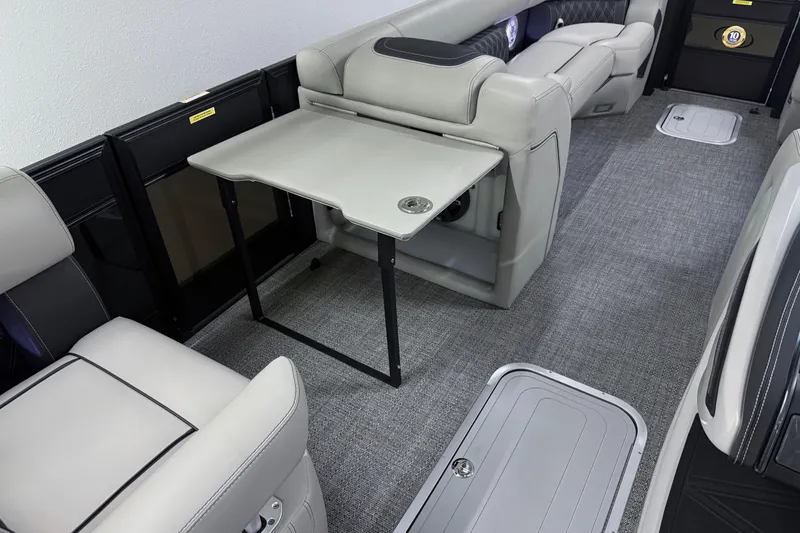 Slide: The Image of 2026 Barletta Lusso 25UA interior with luxurious seating and foldable table. - 38