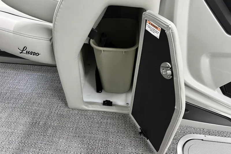 Slide: The Image of Barletta Lusso 25UA 2026 storage compartment with trash bin, open door view. - 40