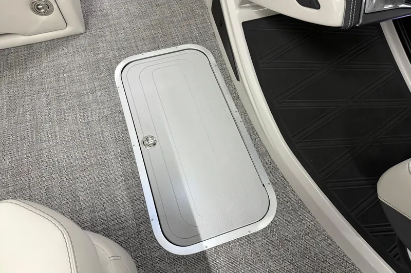 Slide: The Image of Barletta Lusso 25UA 2026 boat interior with storage compartment and textured flooring. - 42