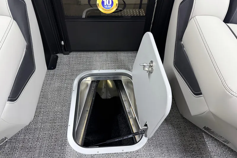 Slide: The Image of Open storage compartment in 2026 Barletta Lusso 25UA boat interior. - 48