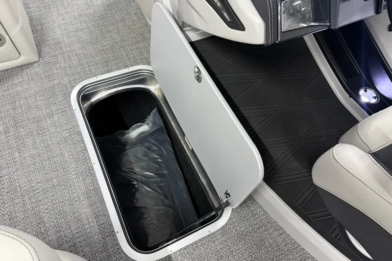 Slide: The Image of 2026 Barletta Lusso 25UA boat interior storage compartment with open lid. - 49