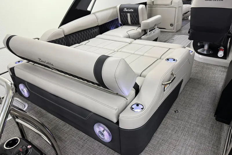 Slide: The Image of Luxurious interior of 2026 Barletta Lusso 25UA pontoon boat with plush seating and cup holders. - 9