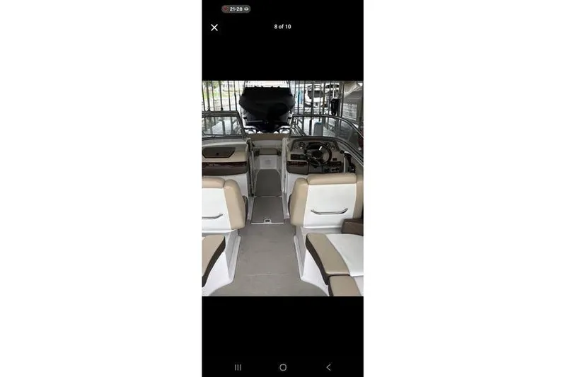 Slide: The Image of Interior view of 2013 Regal 2700 ES Bowrider boat cockpit with steering wheel. - 5