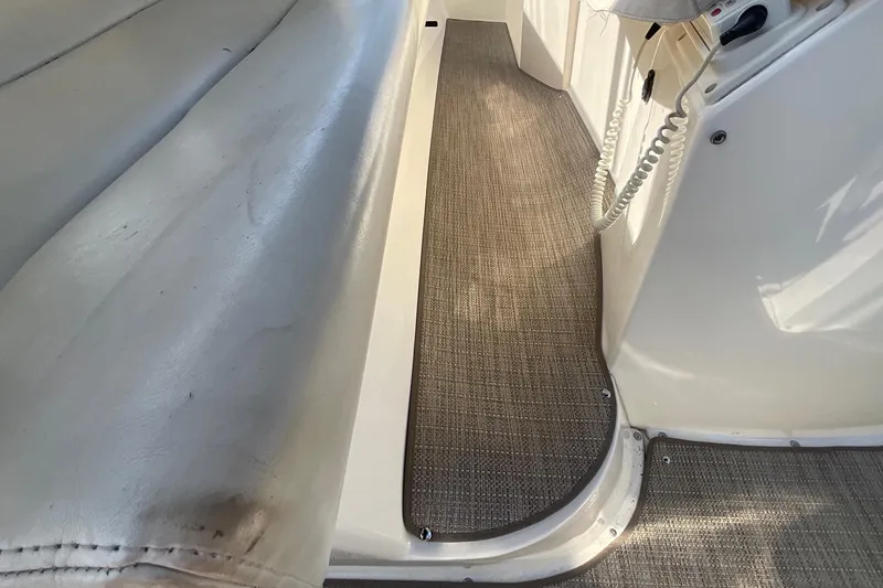 Slide: The Image of Interior view of a 2000 Silverton 392 Motor Yacht, featuring seating and carpeted flooring. - 11