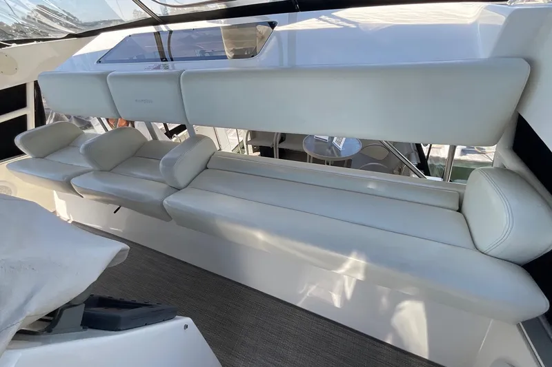 Slide: The Image of Luxurious seating on a 2000 Silverton 392 Motor Yacht, featuring plush white upholstery. - 19
