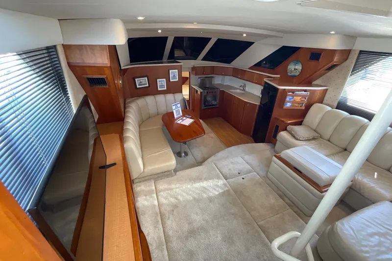 Slide: The Image of Luxurious interior of a 2000 Silverton 392 Motor Yacht with plush seating and modern amenities. - 22