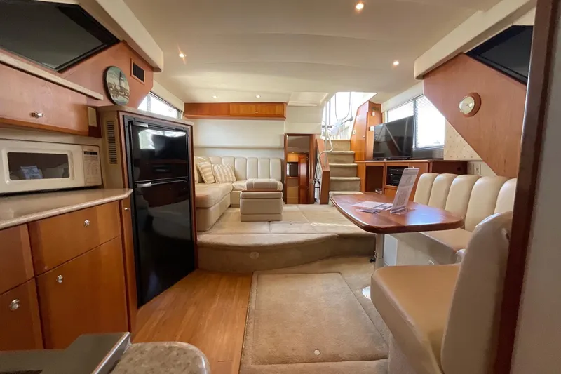 Slide: The Image of Interior of 2000 Silverton 392 Motor Yacht with modern amenities and cozy seating. - 26