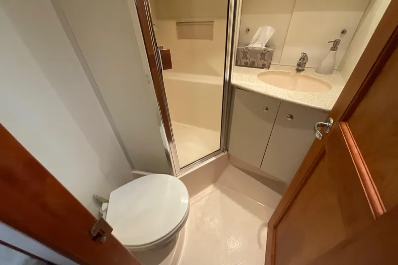 Slide: The Image of Bathroom interior of 2000 Silverton 392 Motor Yacht with shower and sink. - 31