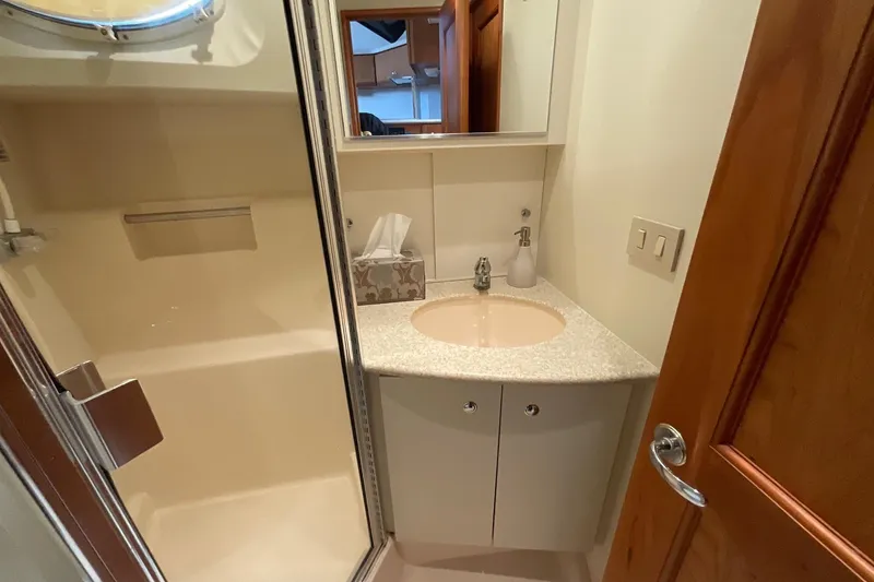 Slide: The Image of Bathroom interior of 2000 Silverton 392 Motor Yacht with sink and shower. - 32