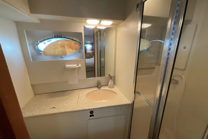 Slide: The Image of Bathroom interior of 2000 Silverton 392 Motor Yacht with sink and shower. - 38