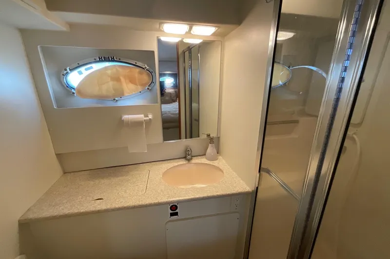Slide: The Image of Bathroom interior of 2000 Silverton 392 Motor Yacht with sink, mirror, and shower. - 39
