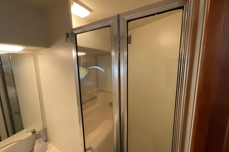 Slide: The Image of Bathroom interior of 2000 Silverton 392 Motor Yacht with shower and mirror. - 40