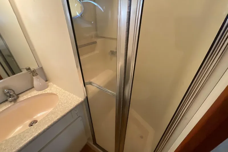 Slide: The Image of Bathroom interior of 2000 Silverton 392 Motor Yacht with shower and sink. - 41