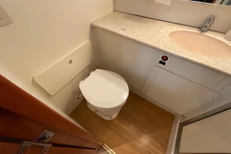 Slide: The Image of Bathroom interior of 2000 Silverton 392 Motor Yacht with toilet and sink. - 42