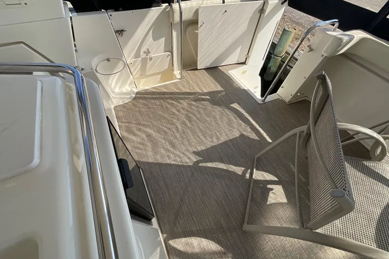 Slide: The Image of 2000 Silverton 392 Motor Yacht interior with seating and open hatch. - 7