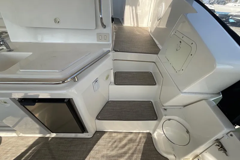Slide: The Image of 2000 Silverton 392 Motor Yacht interior with kitchenette and steps, featuring modern design elements. - 8