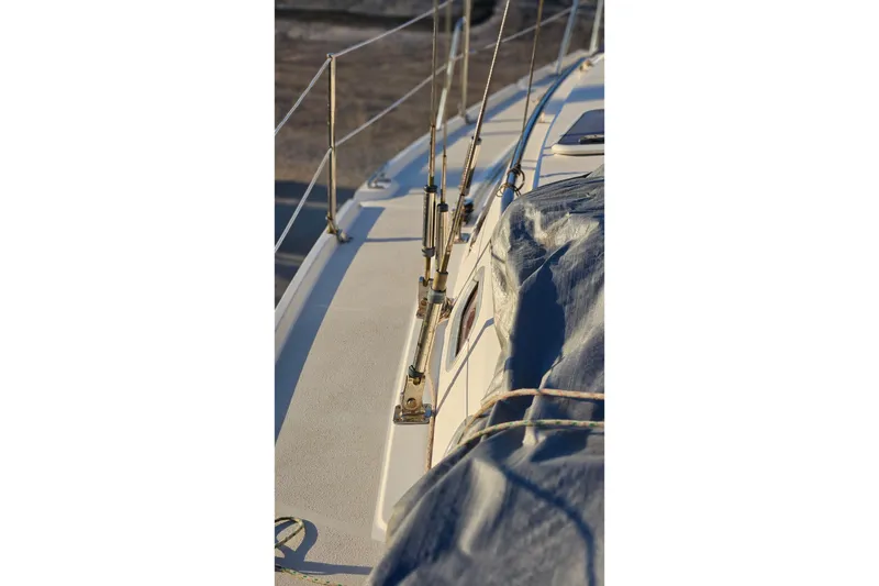 Slide: The Image of Close-up of a 2005 Catalina 350 sailboat deck with rigging and cover. - 10