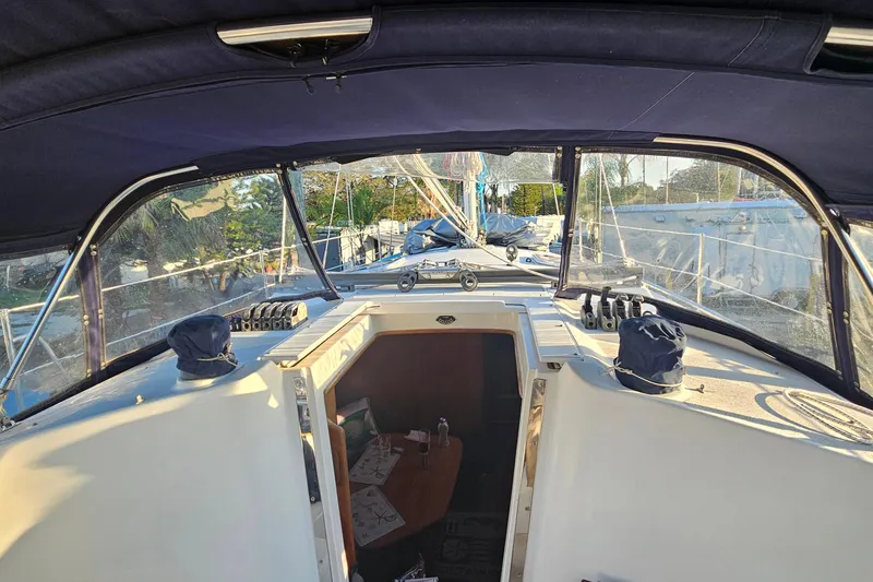 Slide: The Image of Interior view of a 2005 Catalina 350 sailboat cockpit with covered winches. - 13