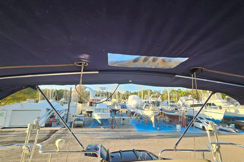 Slide: The Image of View from a 2005 Catalina 350 sailboat, overlooking a marina with boats on stands. - 16