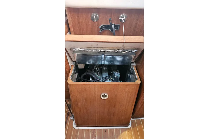 Slide: The Image of Engine compartment of a 2005 Catalina 350 sailboat, showcasing interior mechanics. - 61