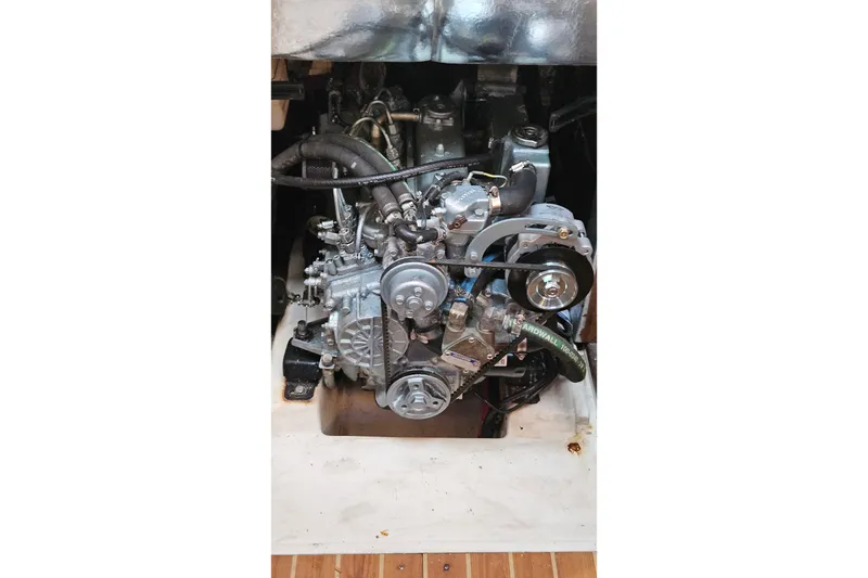 Slide: The Image of Engine of a 2005 Catalina 350 sailboat, showcasing mechanical components. - 63