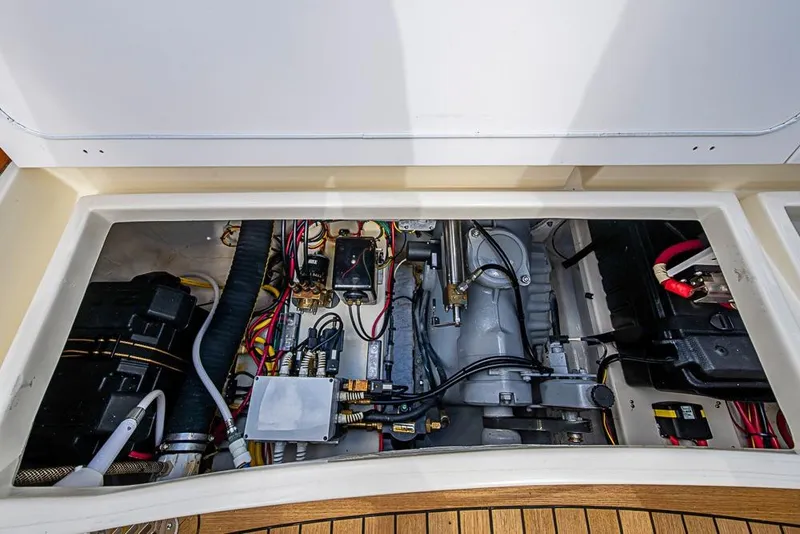 Slide: The Image of Engine compartment of 2004 Hinckley Talaria 29 R with Yanmar diesel engine and seating area. - 13