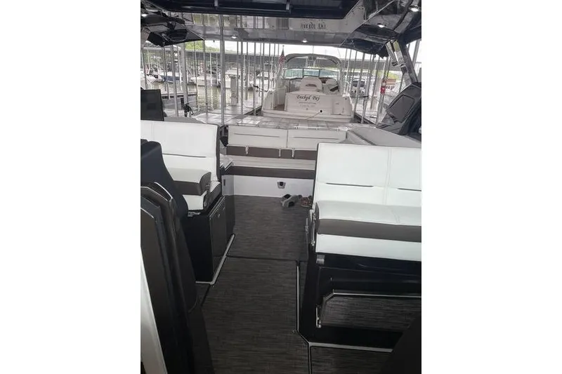 Slide: The Image of 2022 Cobalt A36BR boat interior with white seating and modern design. - 10
