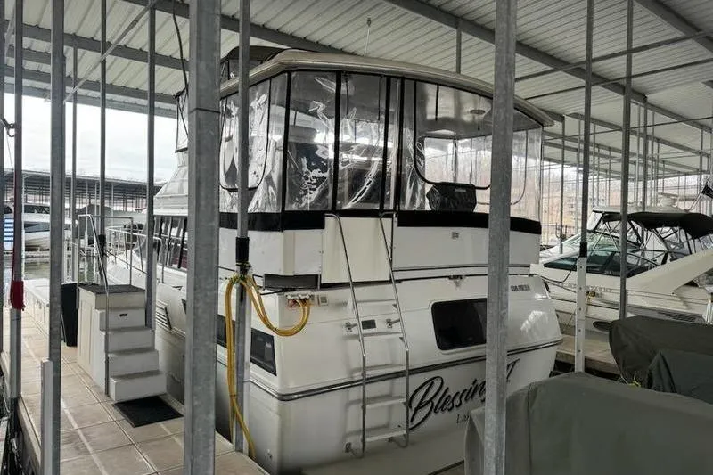 Slide: The Image of 1992 Carver 38 Aft Cabin Motor Yacht docked in covered marina. - 14