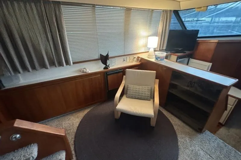 Slide: The Image of Interior of 1992 Carver 38 Aft Cabin Motor Yacht with chair and lamp. - 2