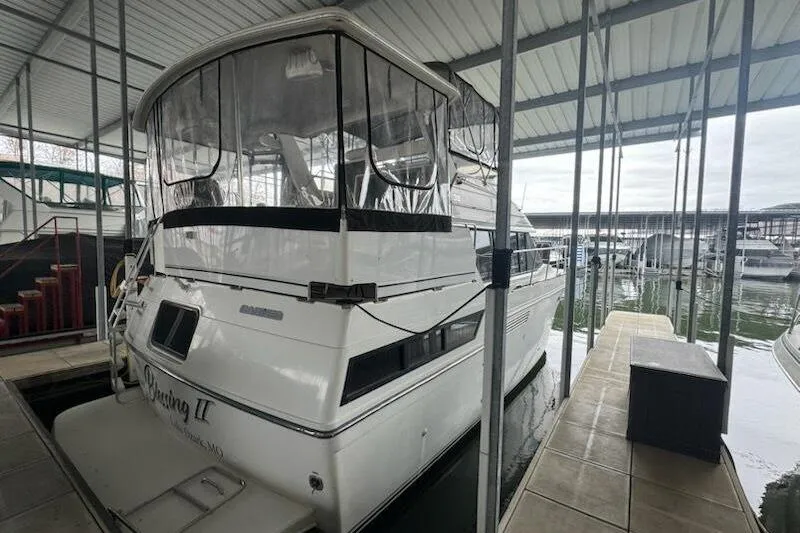 Slide: The Image of 1992 Carver 38 Aft Cabin Motor Yacht docked in a covered marina. - 3