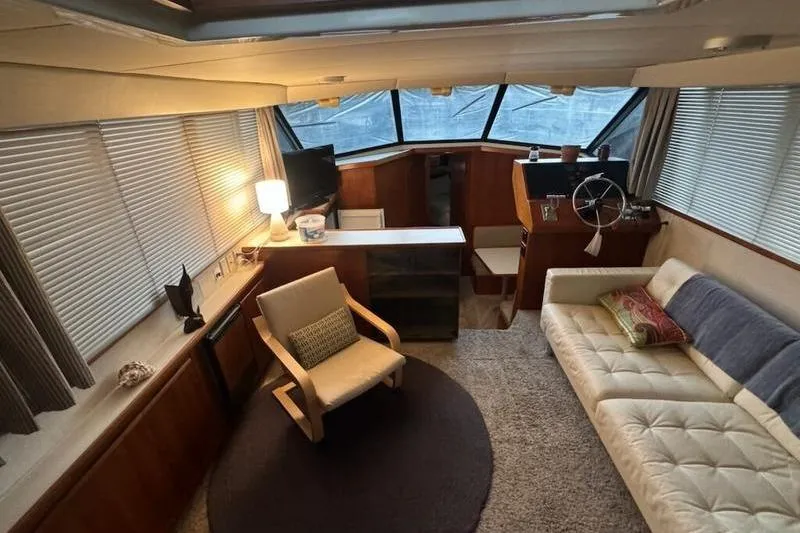 Slide: The Image of Interior of 1992 Carver 38 Aft Cabin Motor Yacht with cozy seating and helm station. - 5