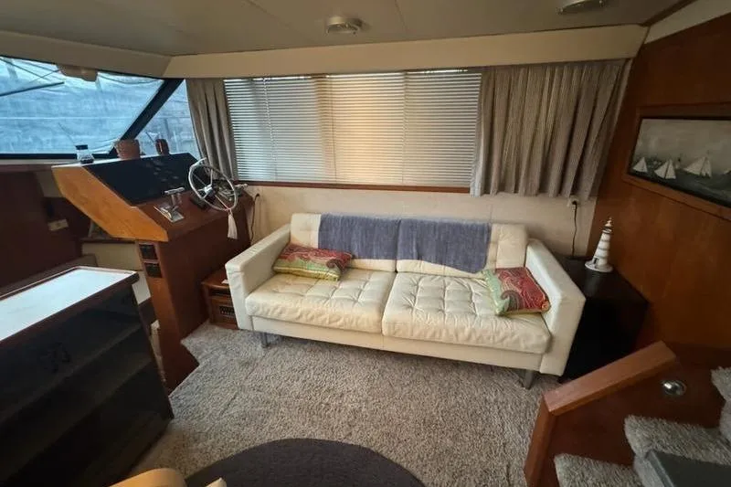 Slide: The Image of Interior of 1992 Carver 38 Aft Cabin Motor Yacht with sofa and helm station. - 7