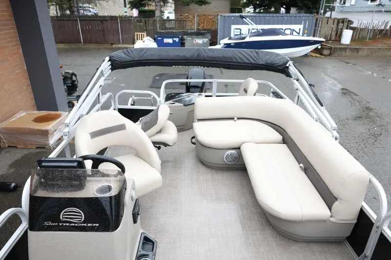 Slide: The Image of 2022 Sun Tracker Bass Buggy 18 DLX pontoon boat with spacious seating and modern design. - 12