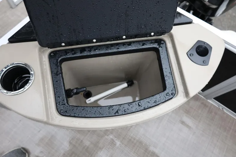 Slide: The Image of 2022 Sun Tracker Bass Buggy 18 DLX livewell with cup holder and wet surface. - 19