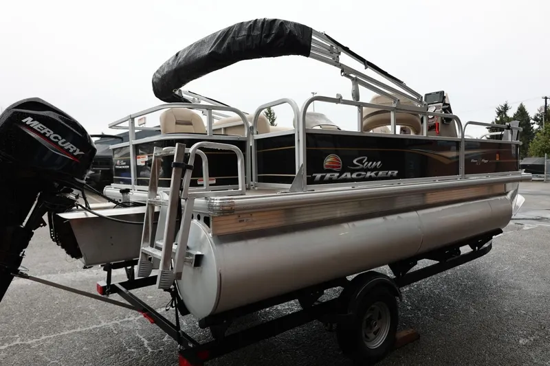 Slide: The Image of 2022 Sun Tracker Bass Buggy 18 DLX pontoon boat with Mercury outboard motor. - 6