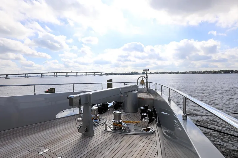 Slide: The Image of Majesty 120 yacht deck, 2025 model, cruising on a sunny day with bridge view. - 12