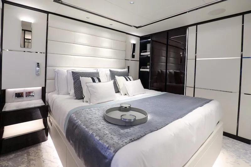 Slide: The Image of Luxurious bedroom interior on 2025 Majesty 120 yacht, featuring elegant bedding and modern design. - 40
