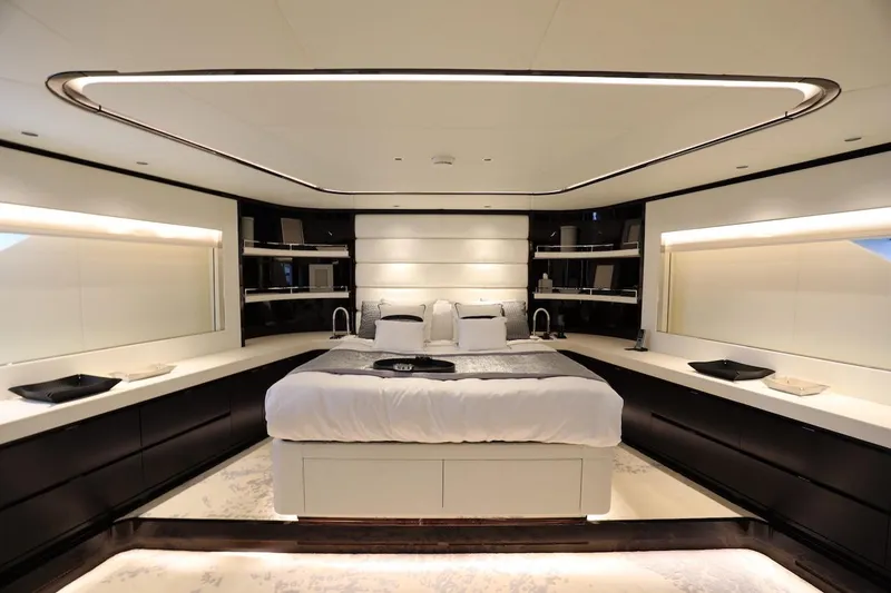 Slide: The Image of Luxurious bedroom interior on 2025 Majesty 120 yacht, featuring modern design and ambient lighting. - 50