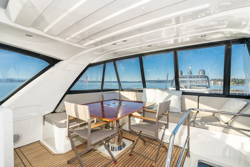 Slide: The Image of Luxurious 2018 Prestige 630 yacht interior with panoramic windows and elegant seating area. - 17